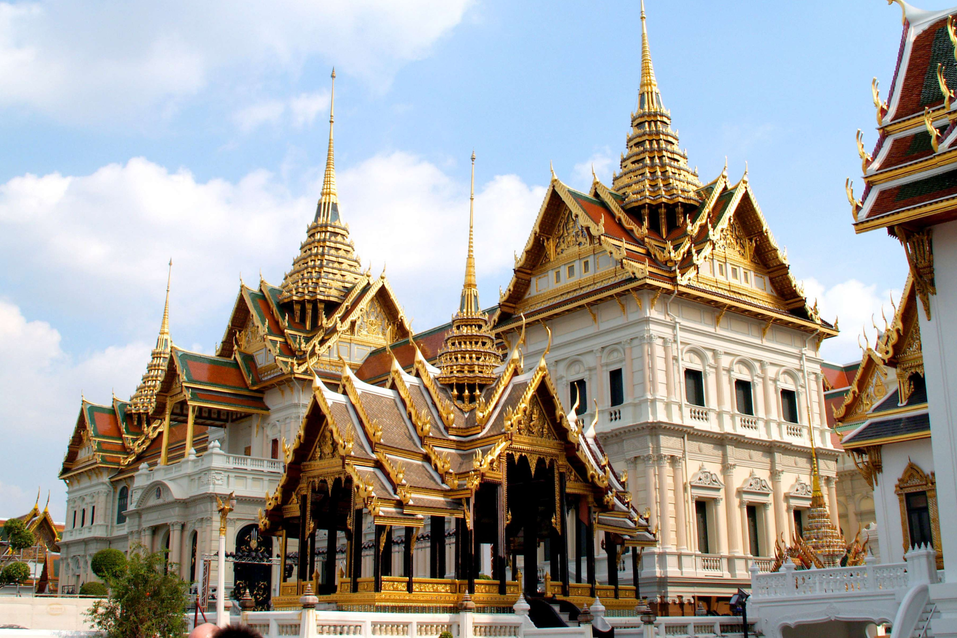 A large building with a lot of roofs and towers