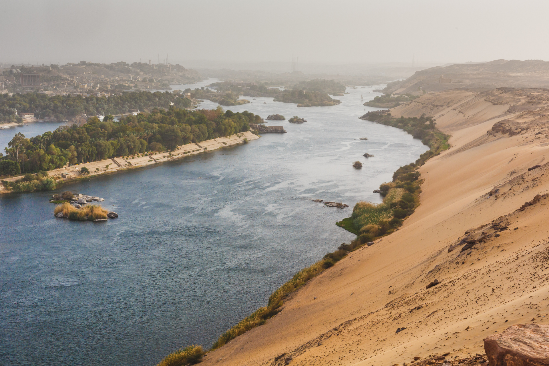 An aerial view of a river flowing through a desert landscape.