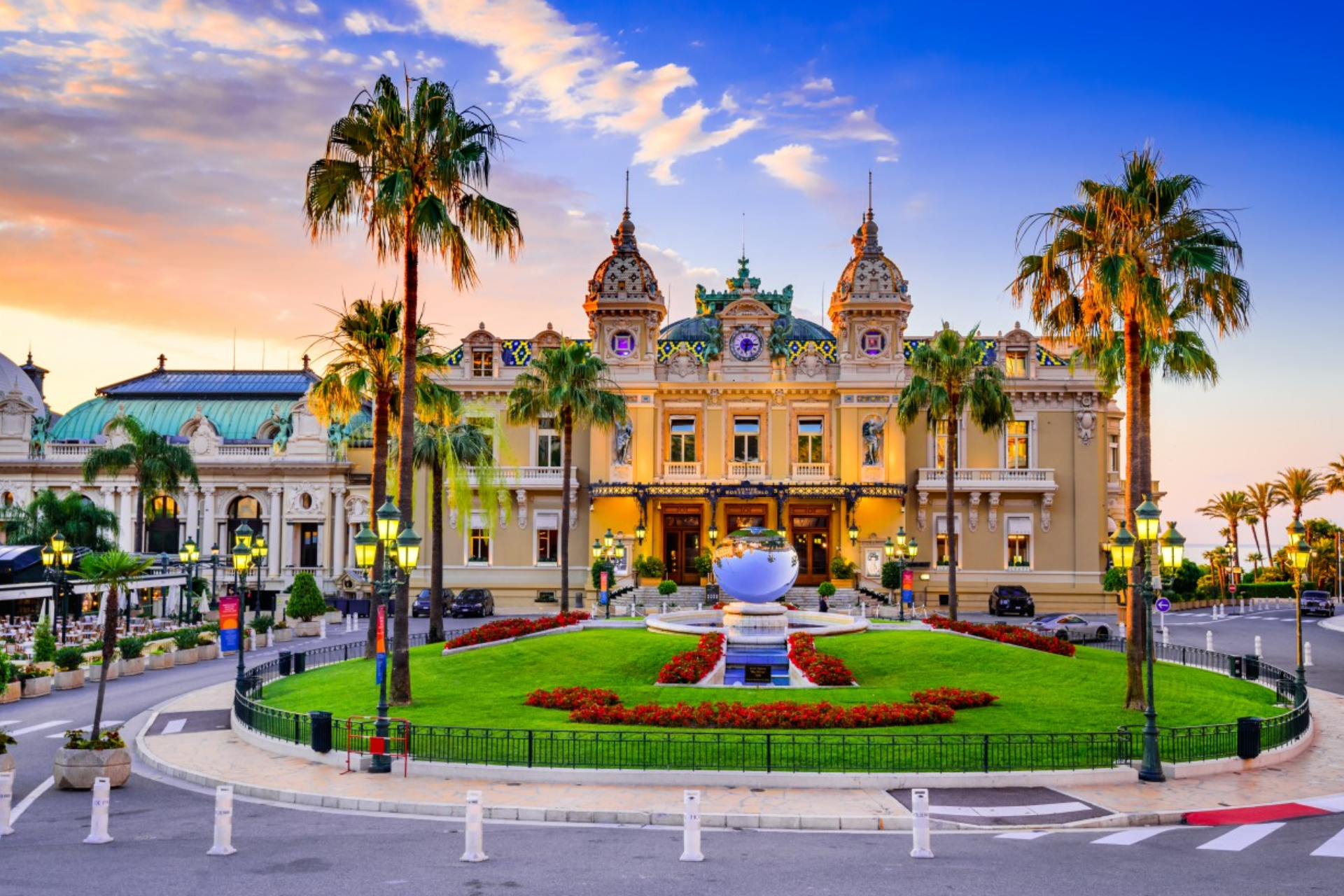 A large building with palm trees in front of it.