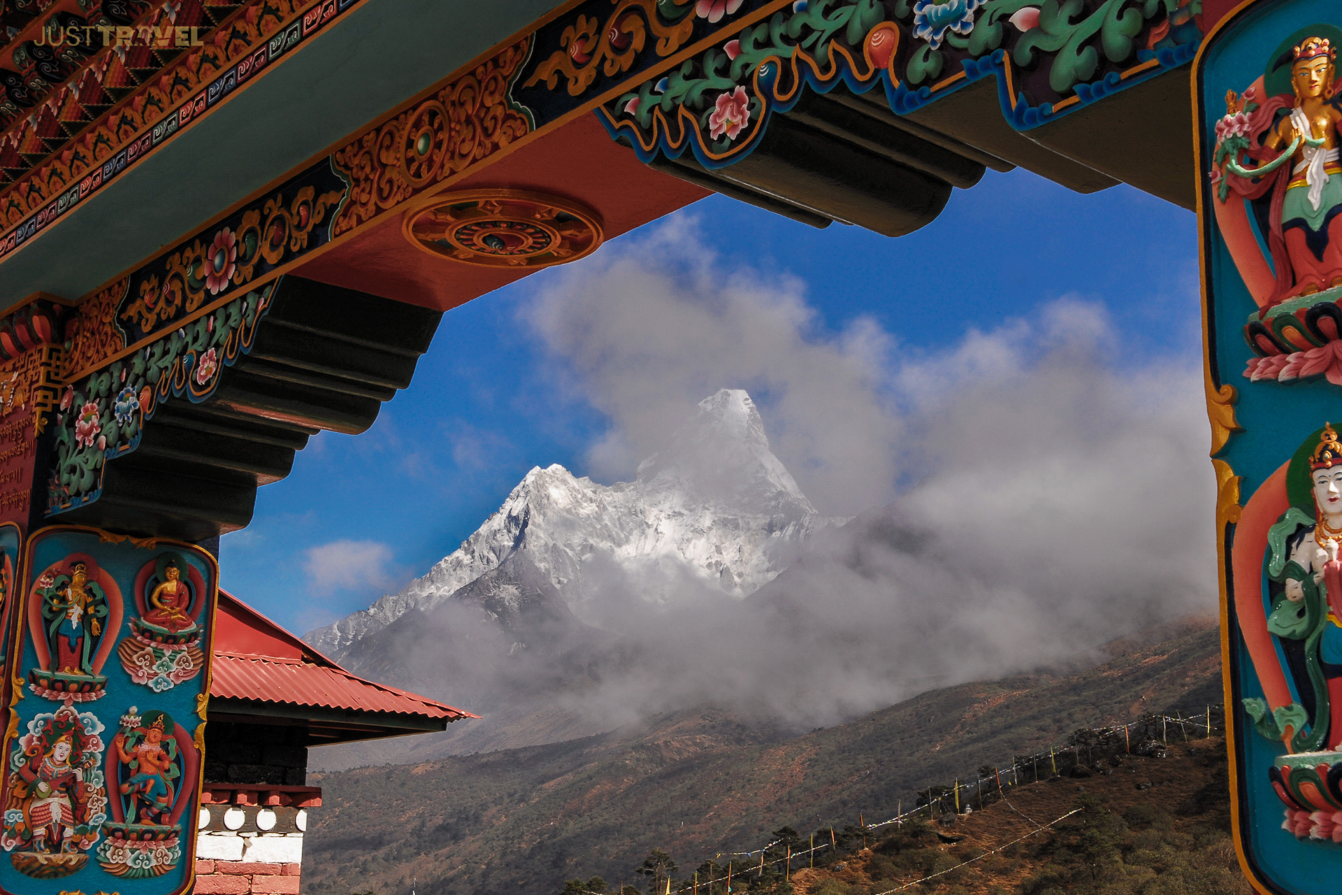 A colorful archway with a mountain in the background