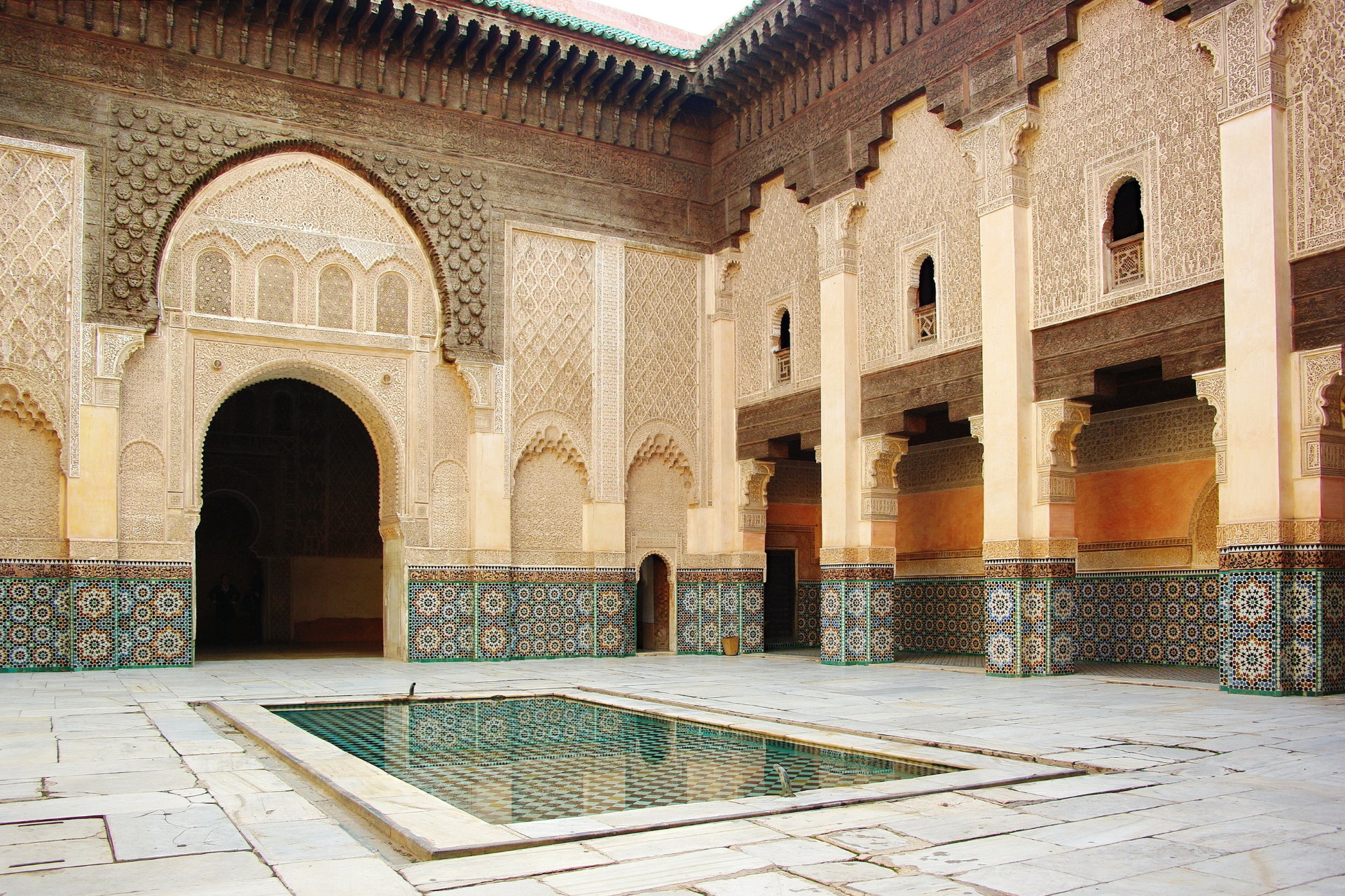 A large building with a pool in the middle of it