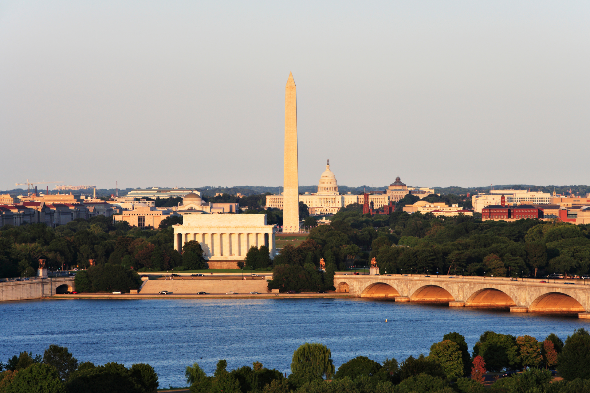 A view of washington d.c. with the washington monument in the foreground