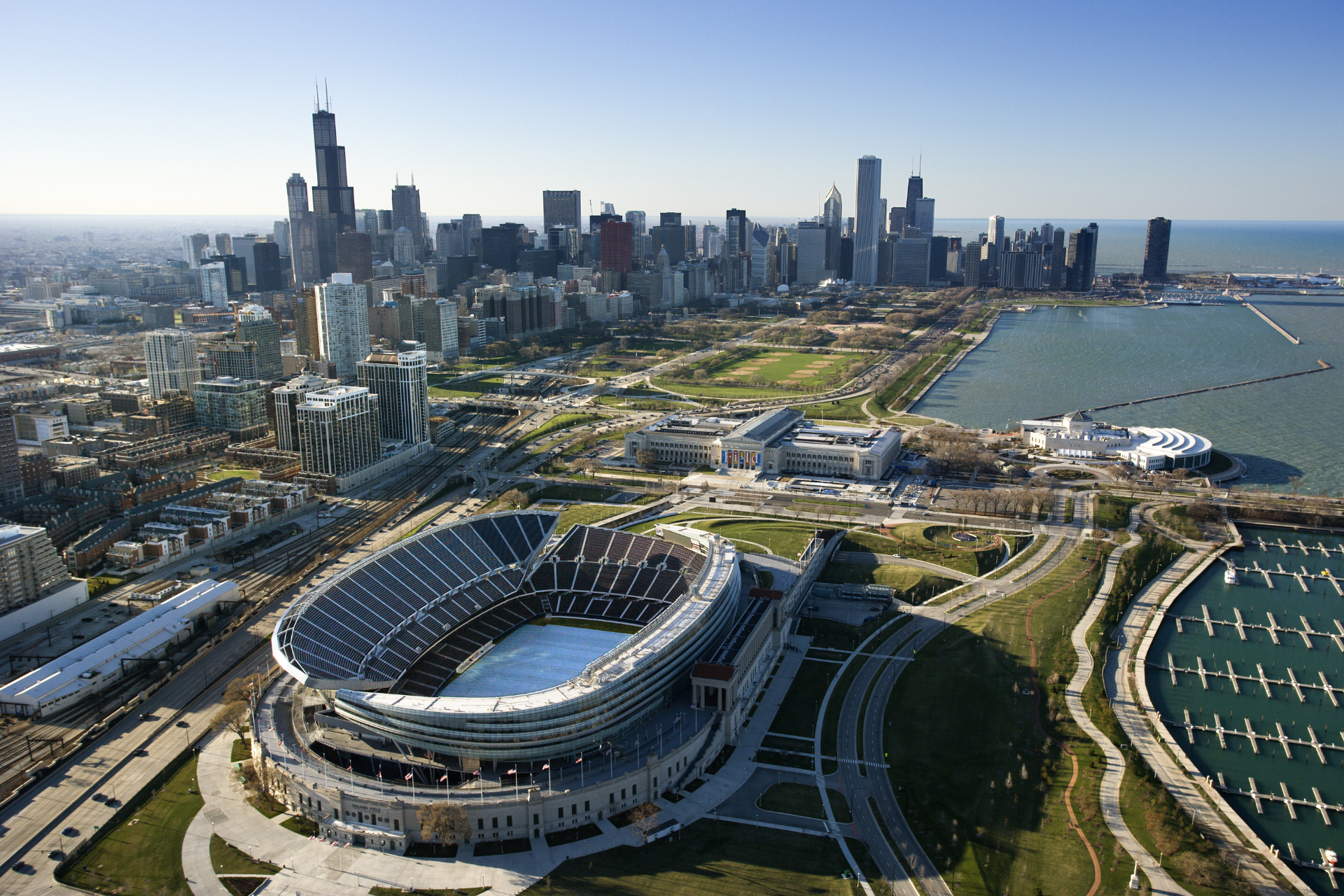 An aerial view of a large stadium in the middle of a city