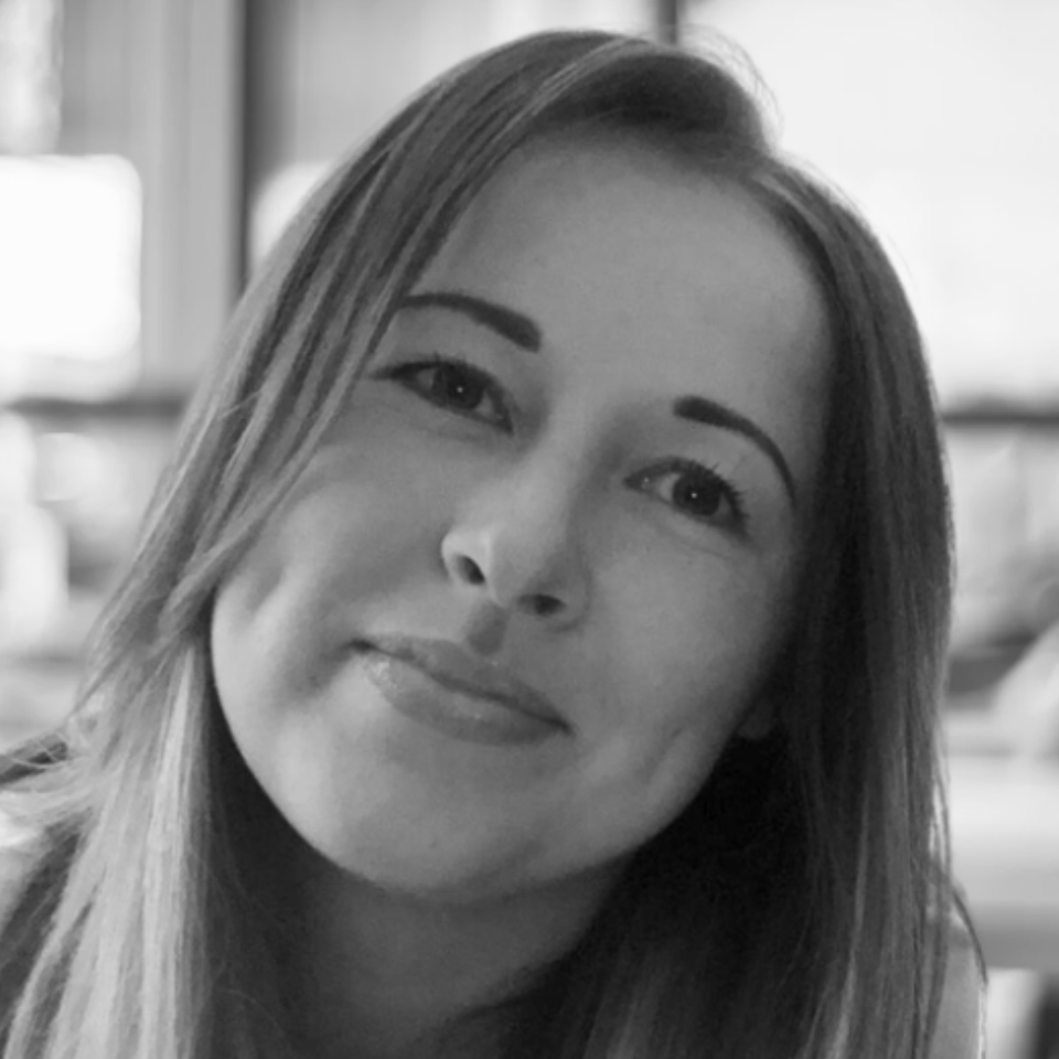 A close up of a woman 's face in a black and white photo.