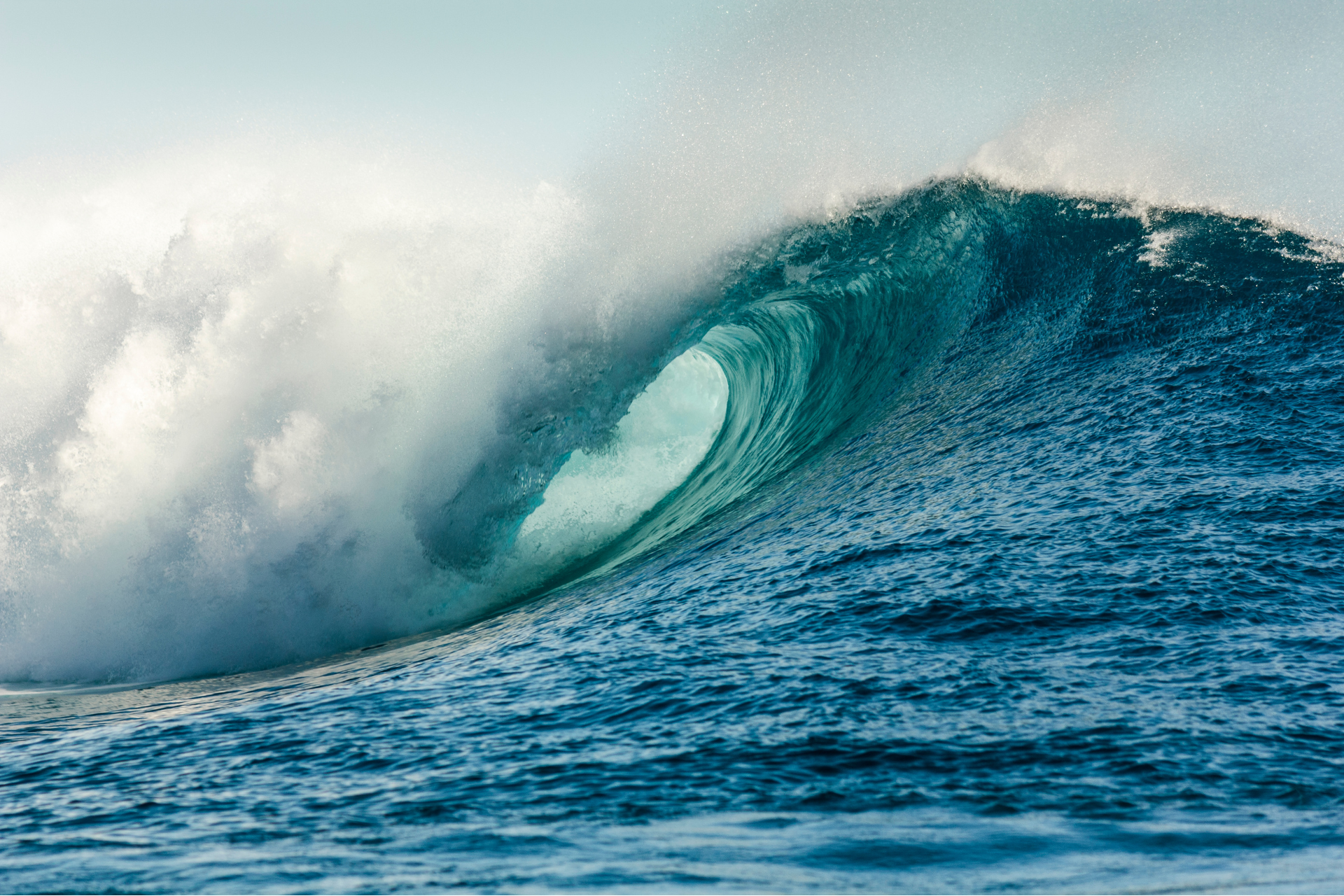 A large wave is breaking in the ocean.