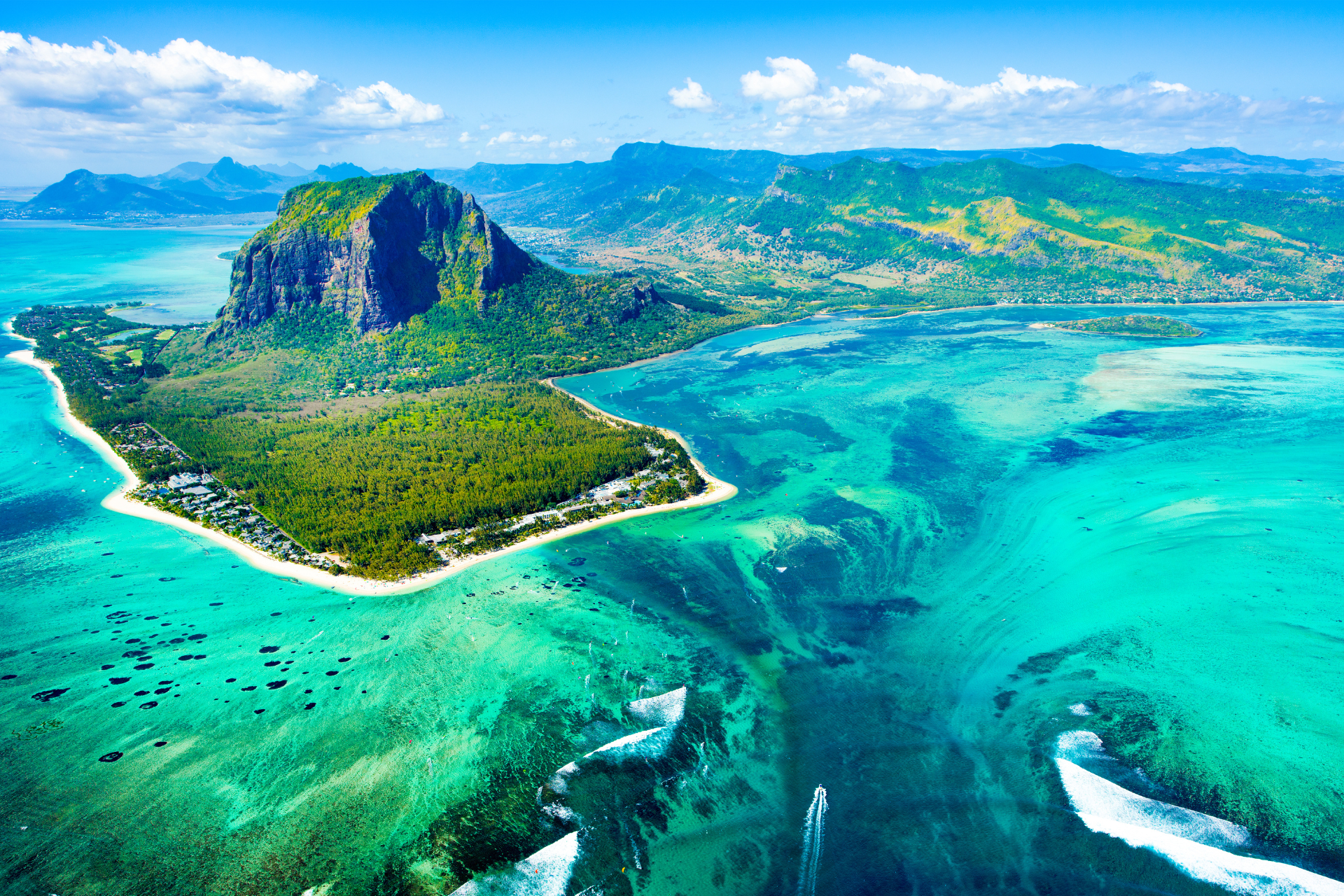 An aerial view of a small island in the middle of the ocean.