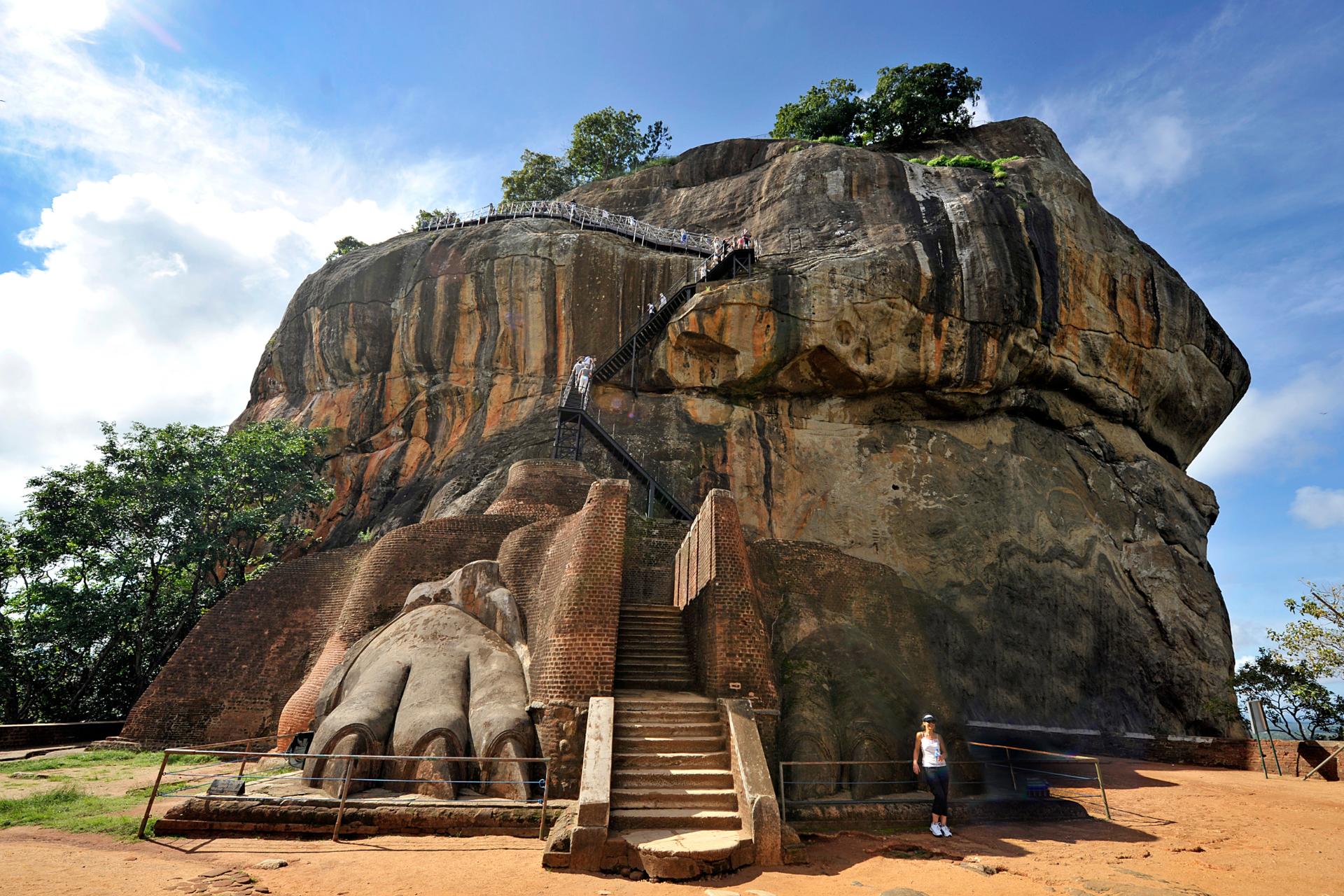 A large rock with stairs leading up to it.