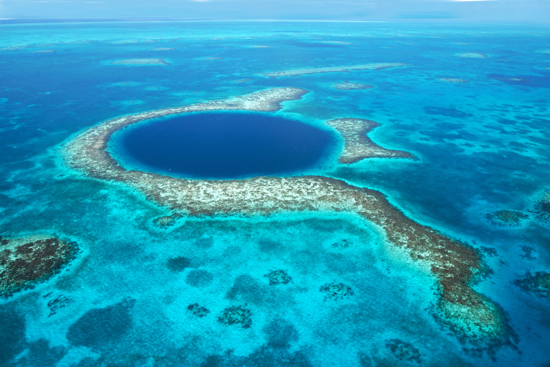 An aerial view of a large hole in the middle of the ocean