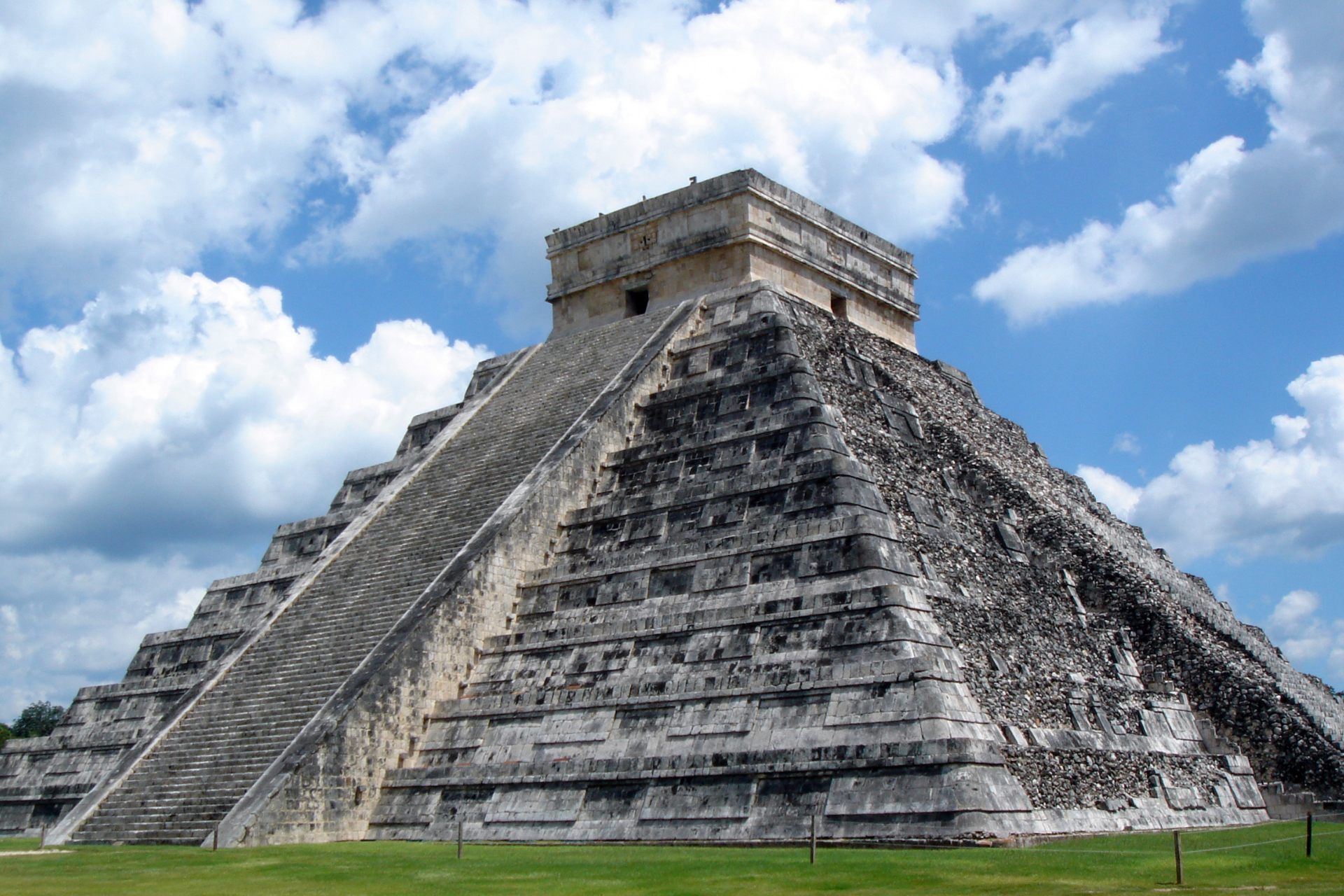 A large stone pyramid with stairs leading up to it