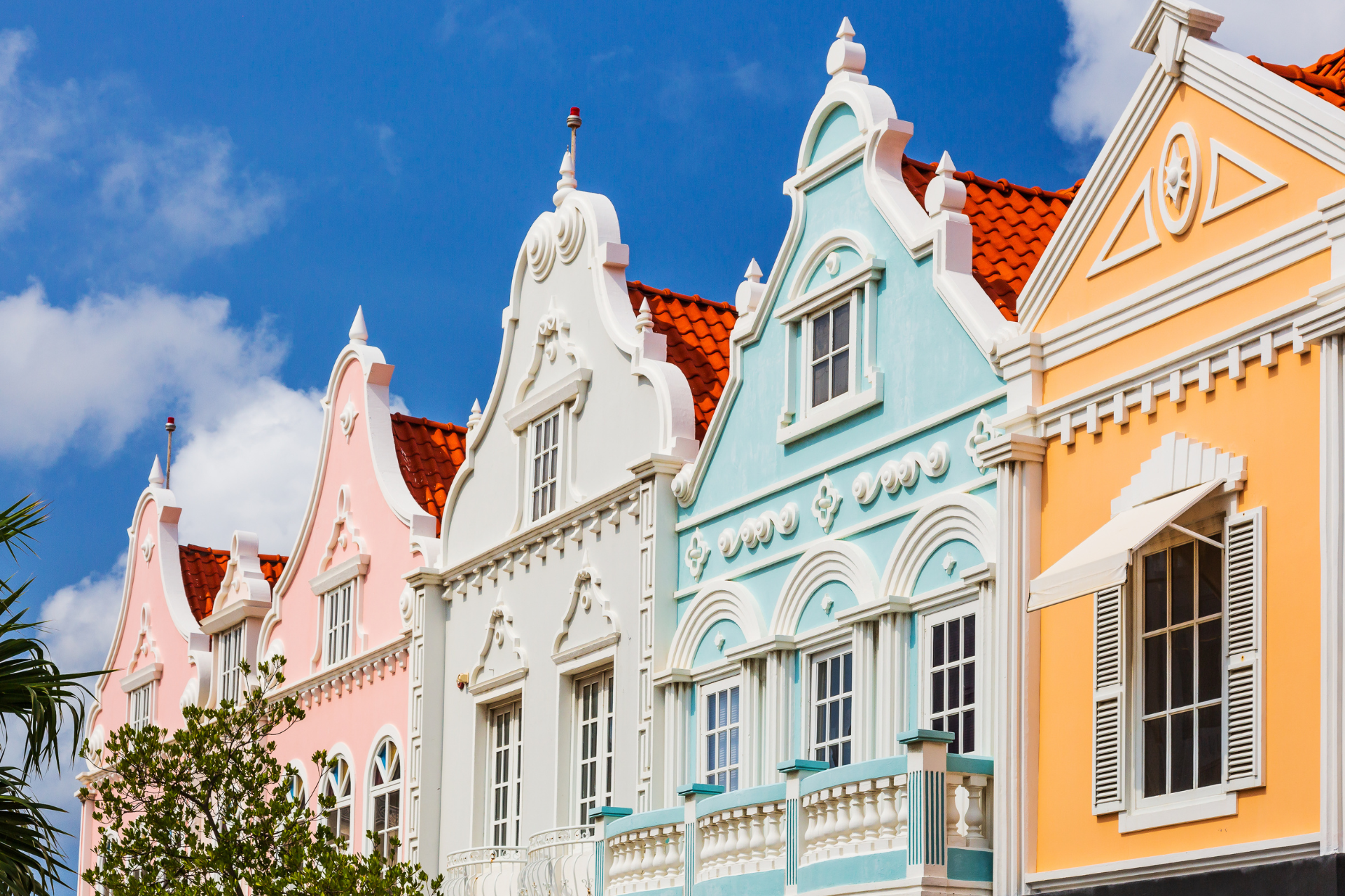 A row of colorful buildings with a blue sky in the background.