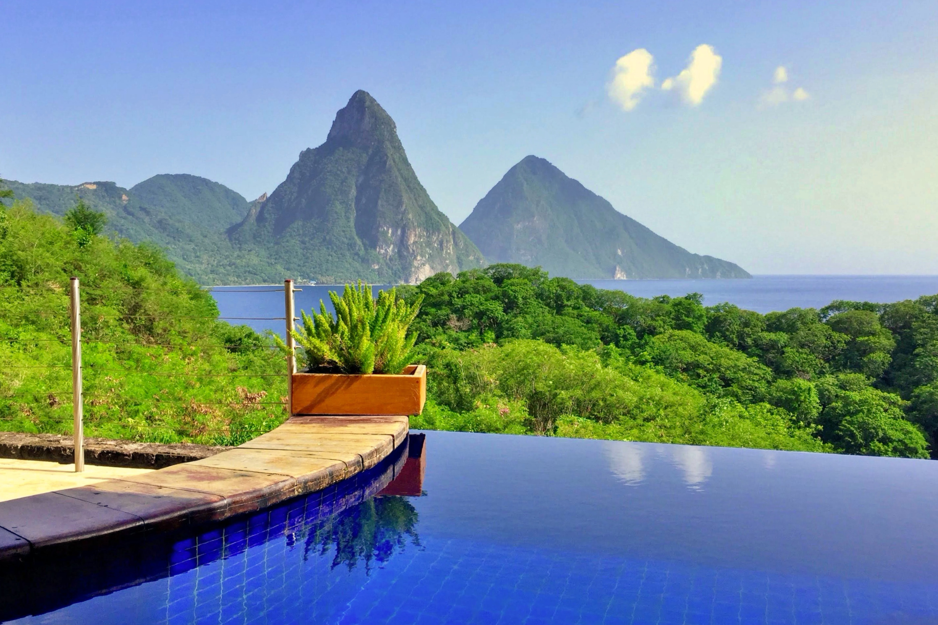 A swimming pool with a view of mountains and the ocean