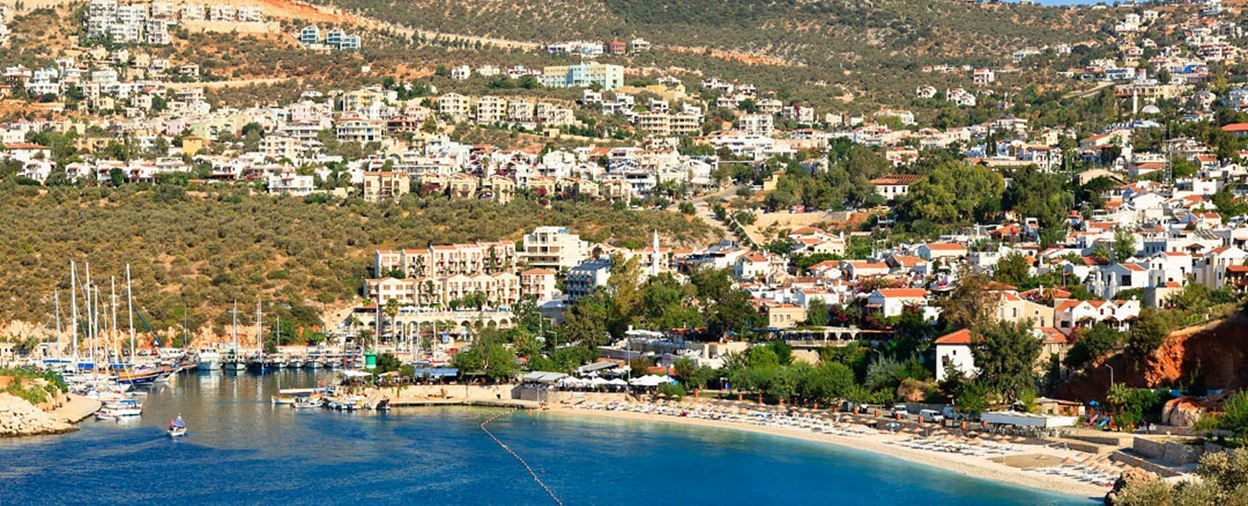 An aerial view of a small town next to a body of water.