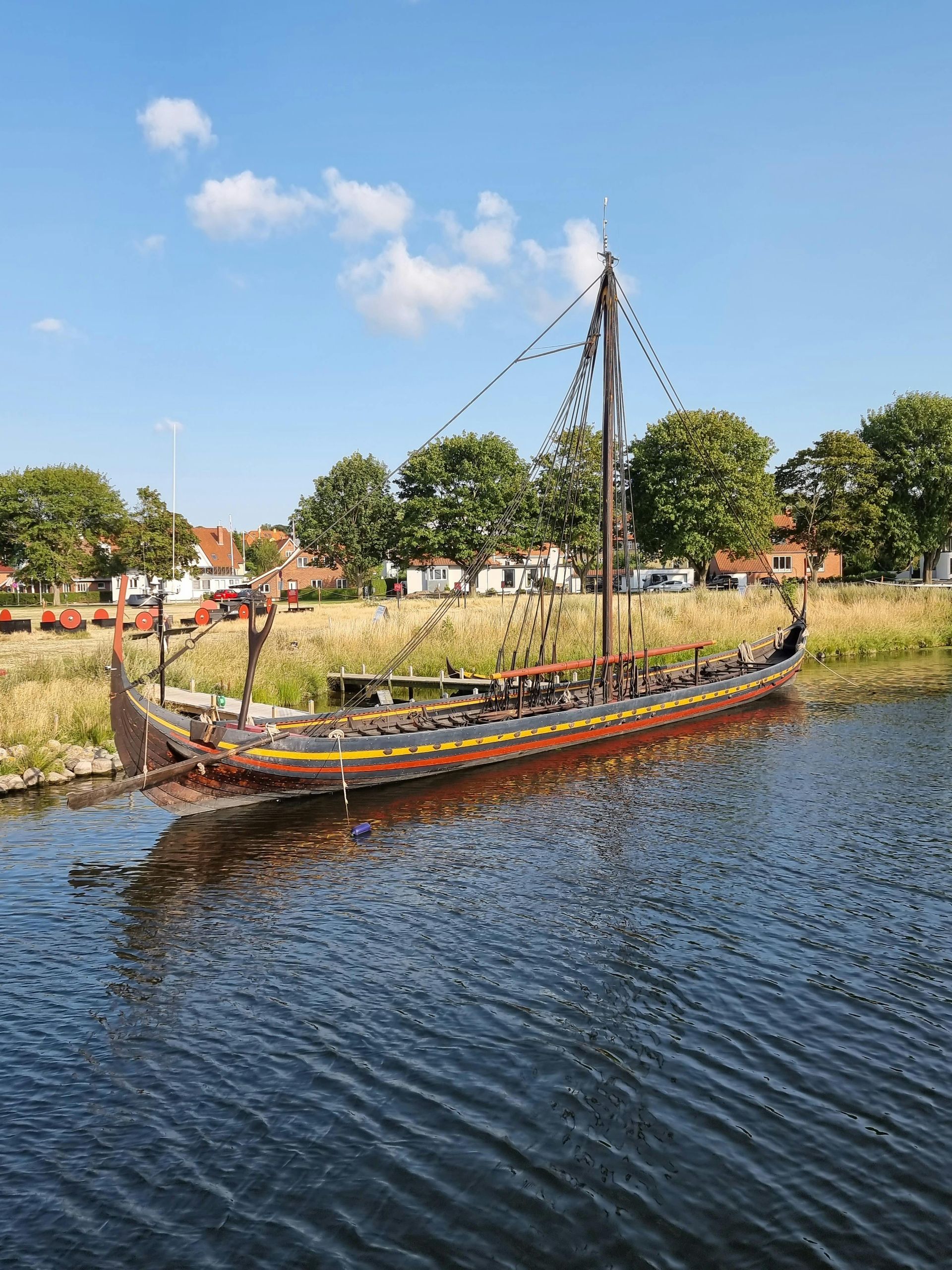 A boat is floating on top of a body of water.