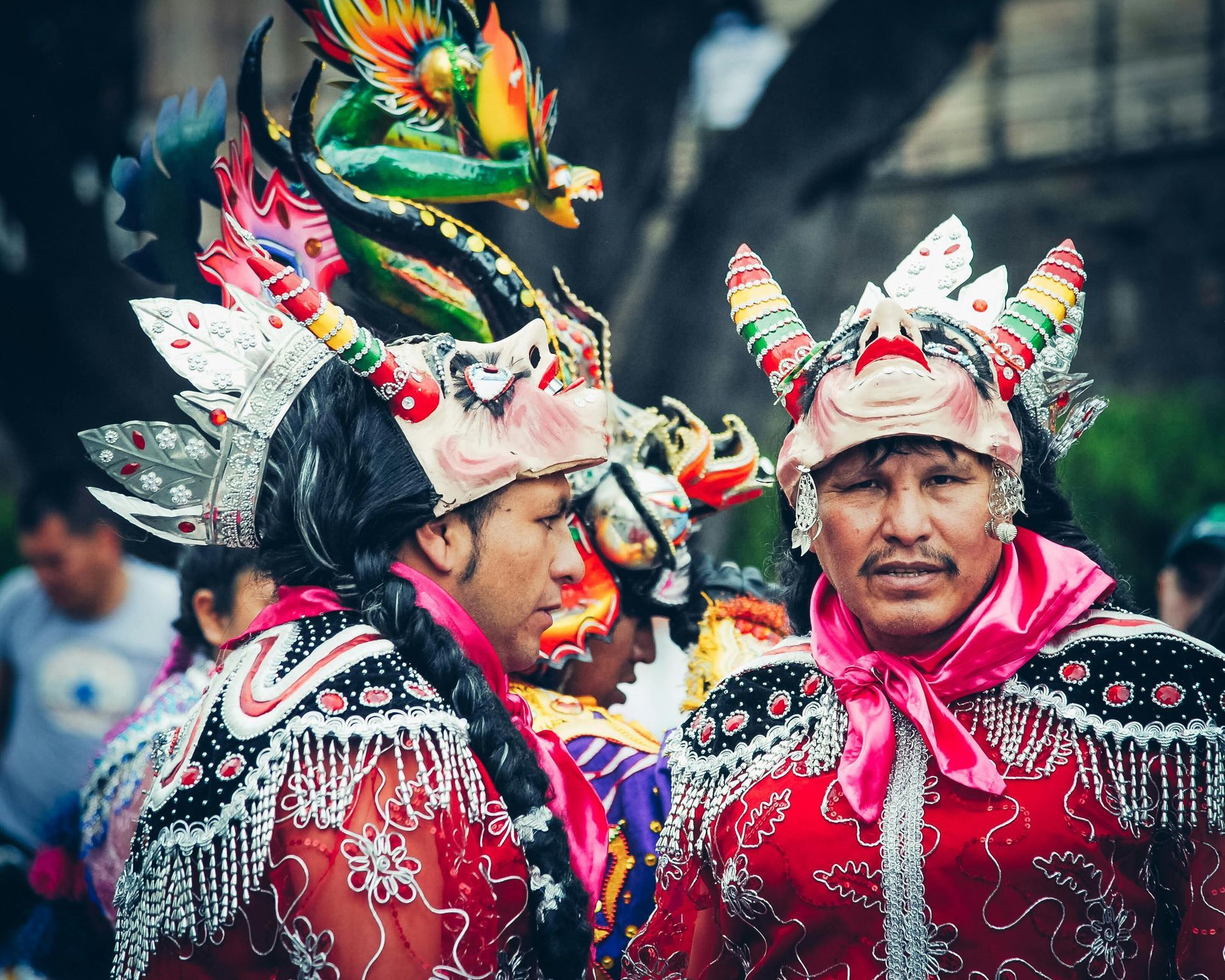 A group of men in colorful costumes are standing next to each other