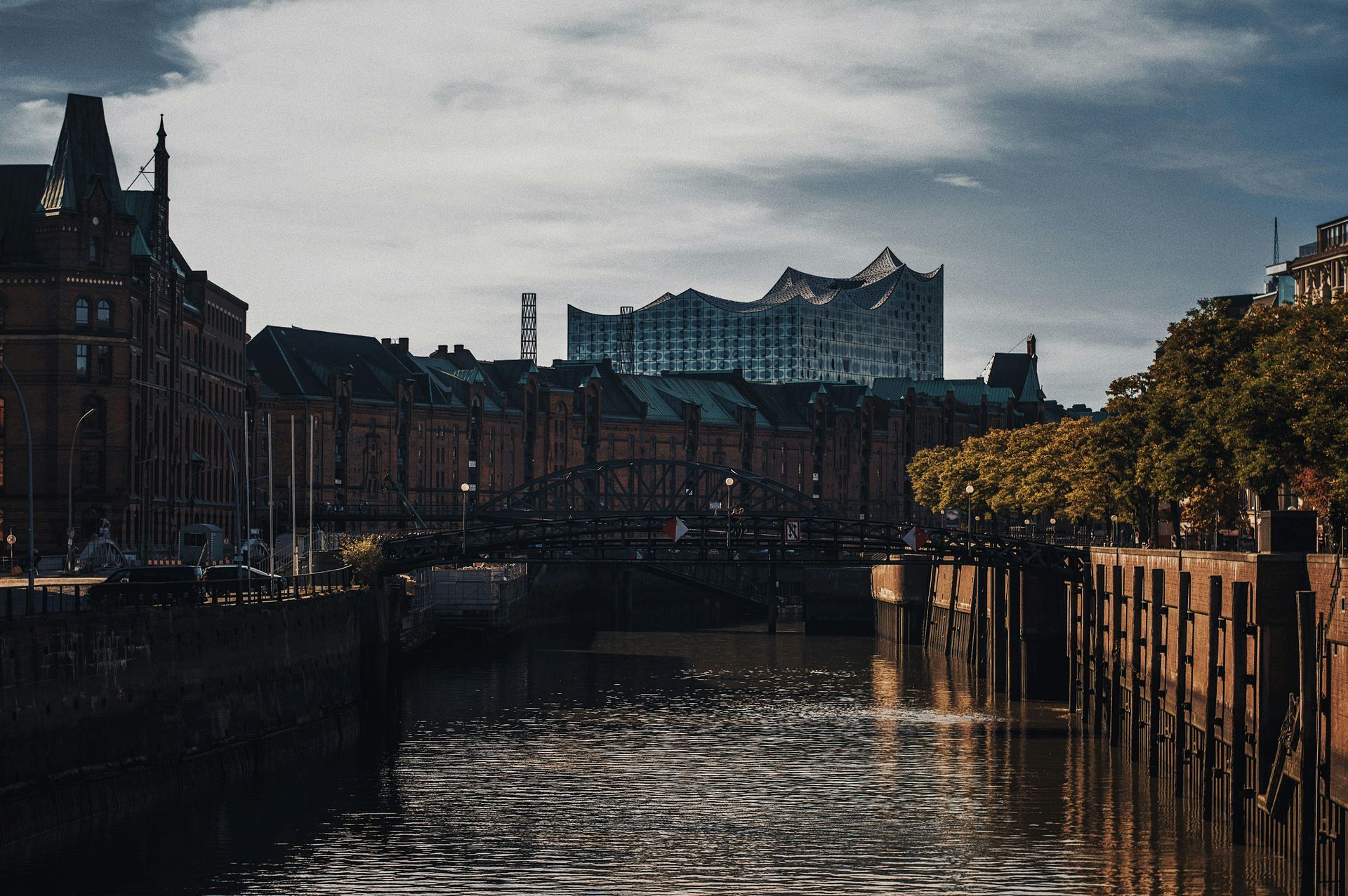 A river runs through a city with buildings in the background.