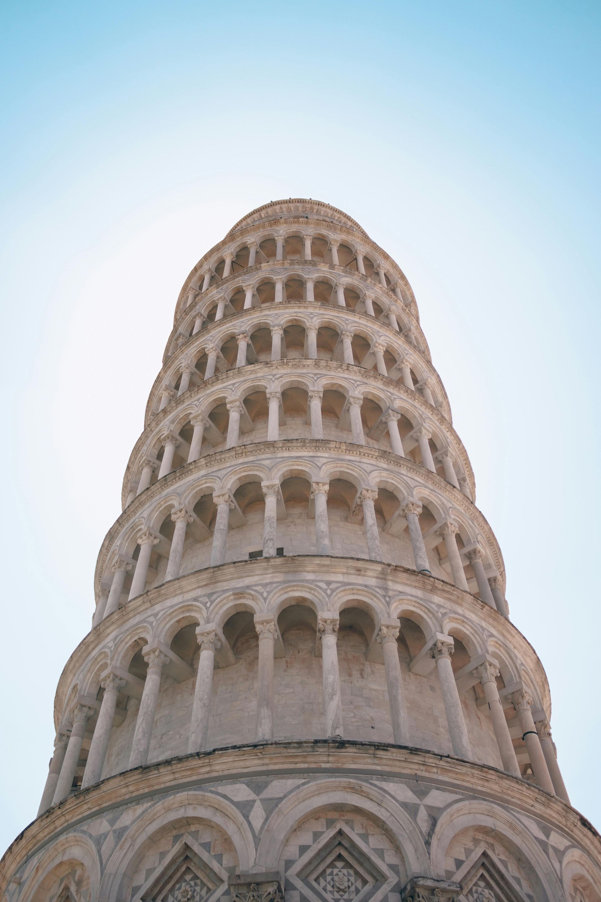 Looking up at the leaning tower of pisa in italy.