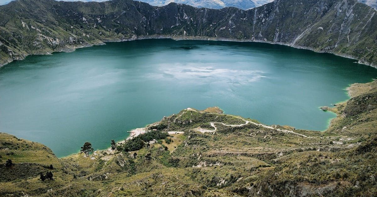 There is a large lake in the middle of a mountain surrounded by mountains.