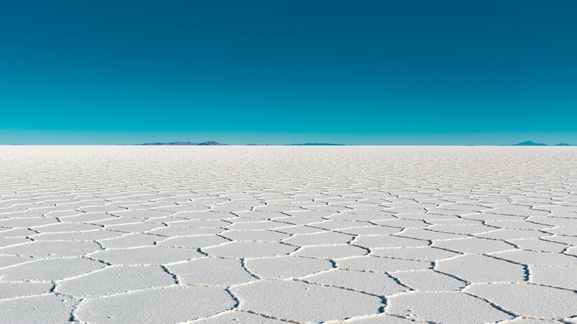 A large white desert with a blue sky in the background.