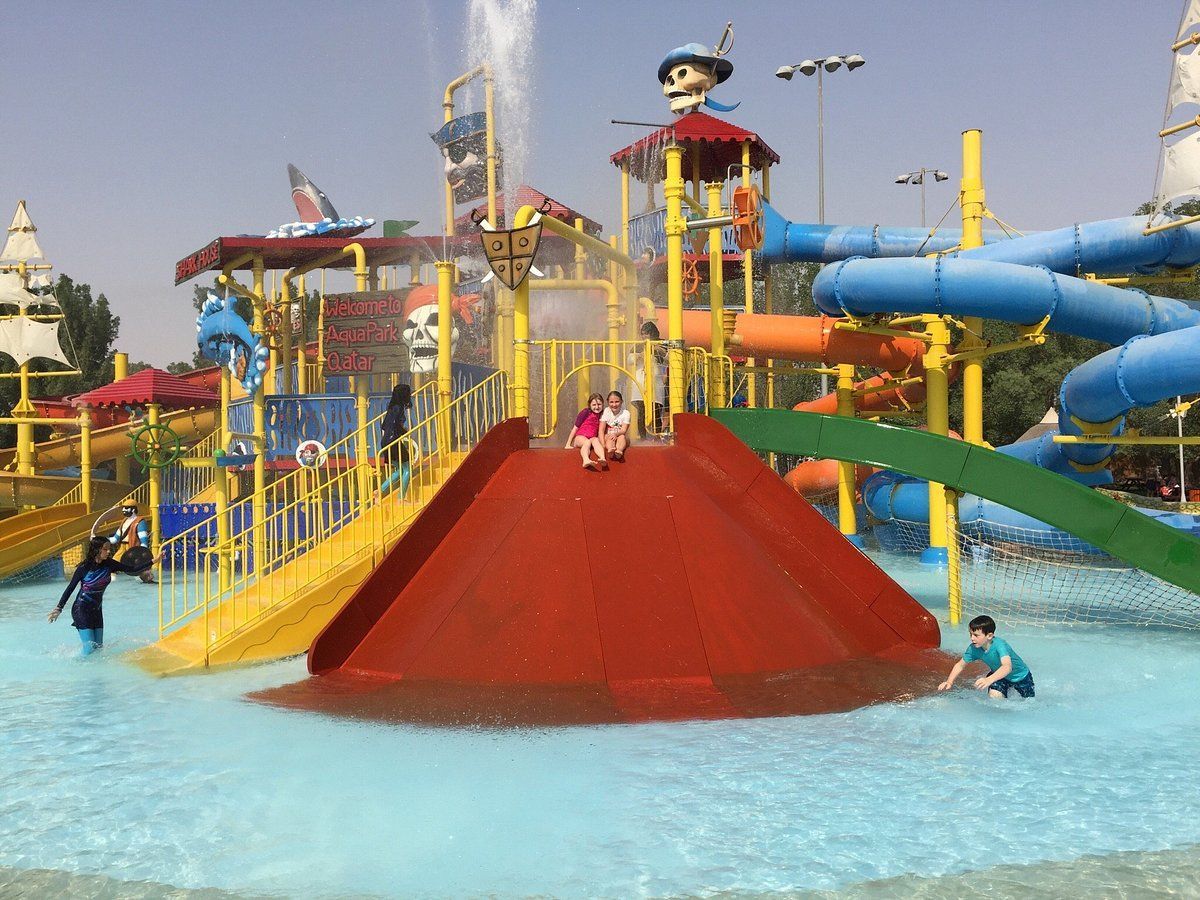 A group of children are playing in a water park.