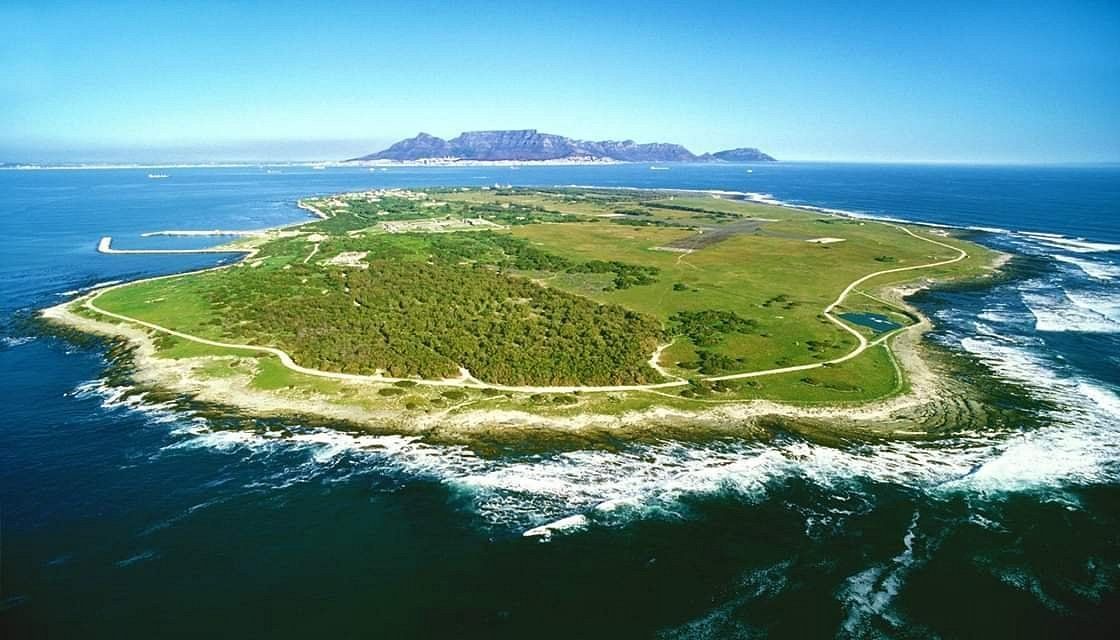 An aerial view of a small island in the middle of the ocean.