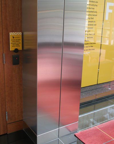 High End Metal Fabrication — Metal wall beside the door front view in South San Francisco, CA