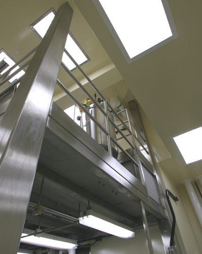 Metal Fabrications Bay Area — Yellow stair railings inside the laboratory in South San Francisco. CA