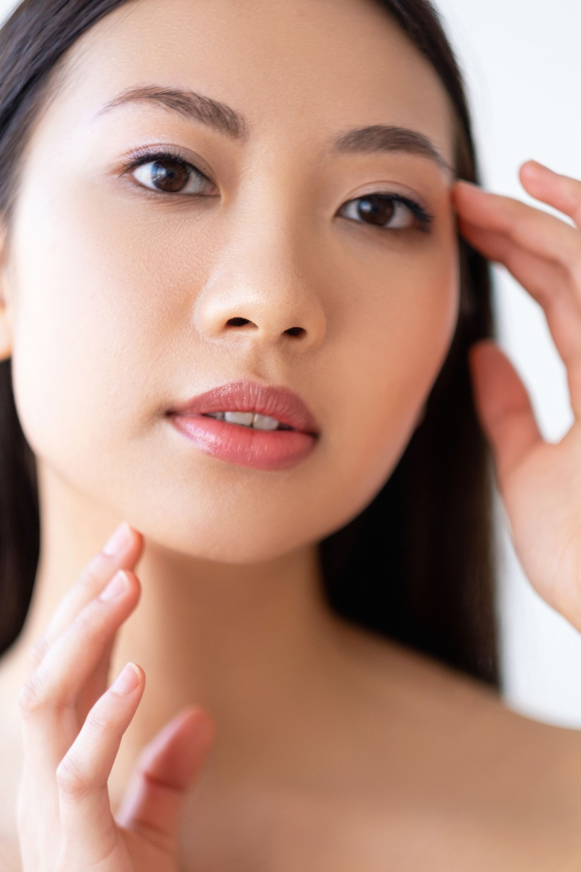 a woman is getting a facial treatment at a spa .