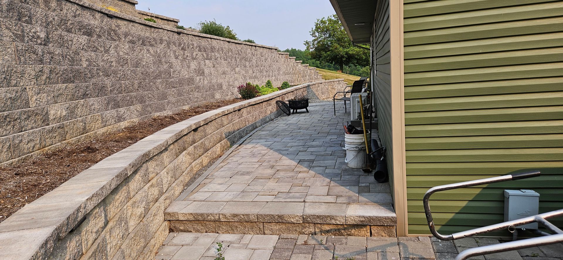 Hardscape service from hammond's company car parked  on the side