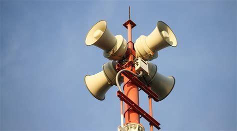 A Tower With a Lot of Speakers on It Against a Blue Sky — Advanced Alarms Mackay Pty Ltd In South Mackay, QLD