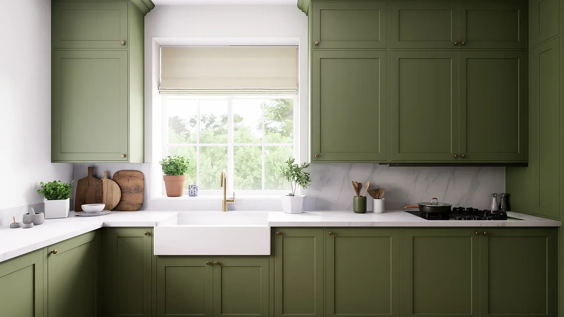 A modern kitchen with green cabinets and a farmhouse sink