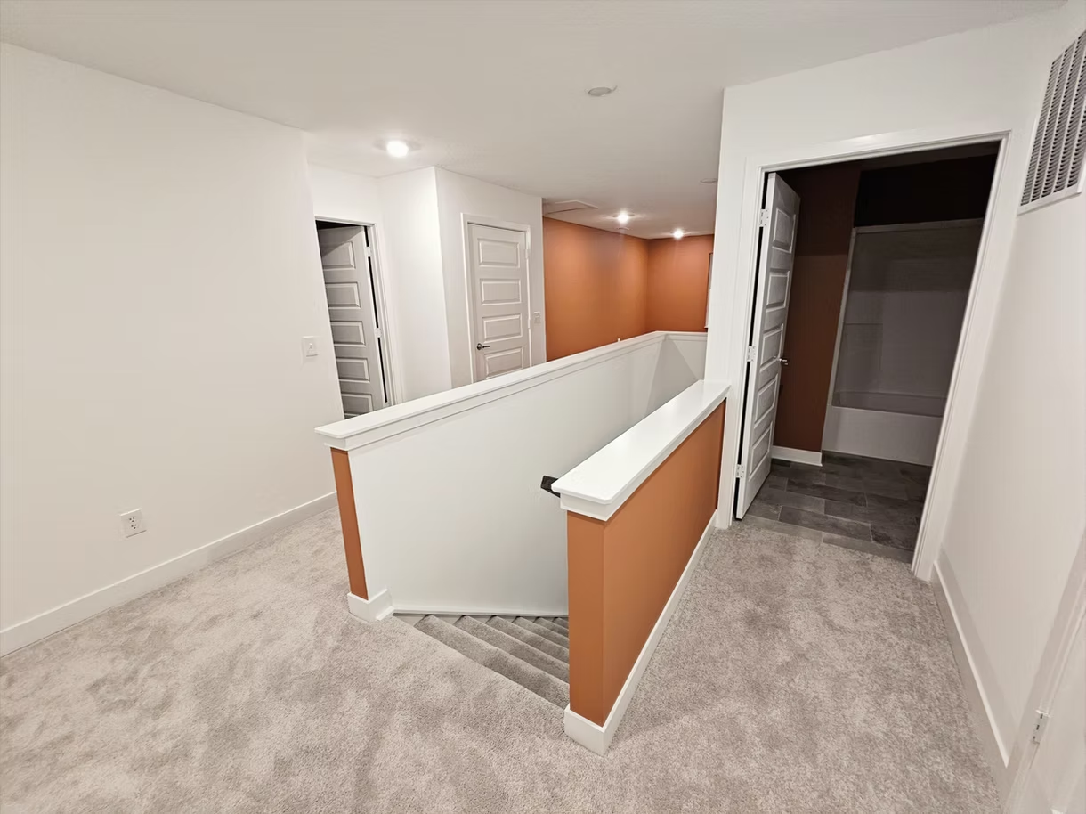 There is a staircase leading up to the second floor of a house.