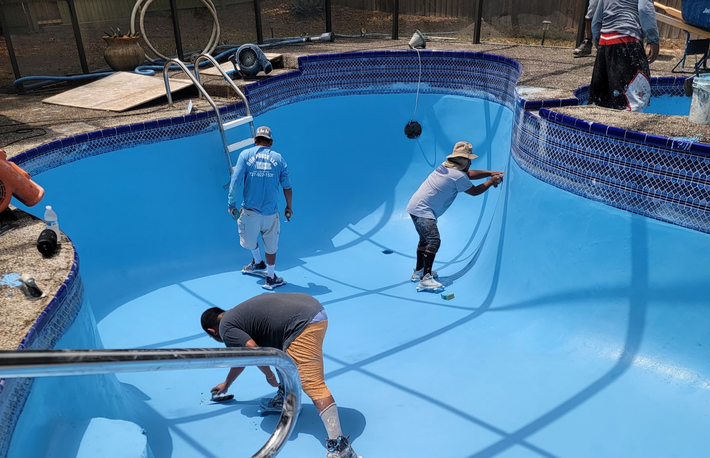 Man Doing Pool Maintenance — Dunedin, FL — Expert Pool Services