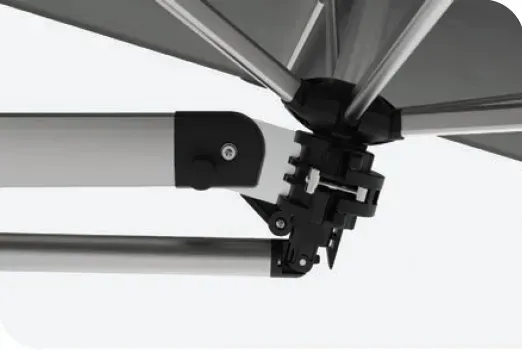 A black awning is attached to the side of a building