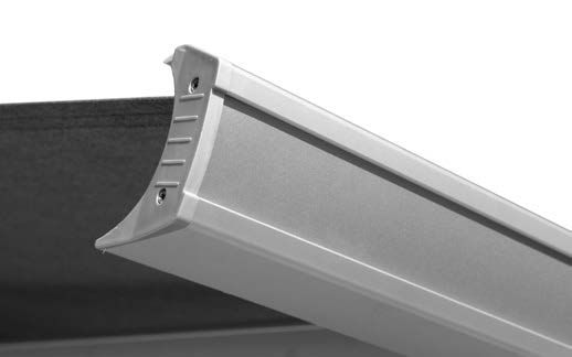 A close up of a metal railing on a white background.