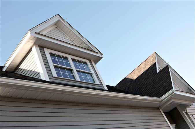 Looking Up At The Roof Of A House With A Window — All Style Home Improvements in Hay Point, QLD