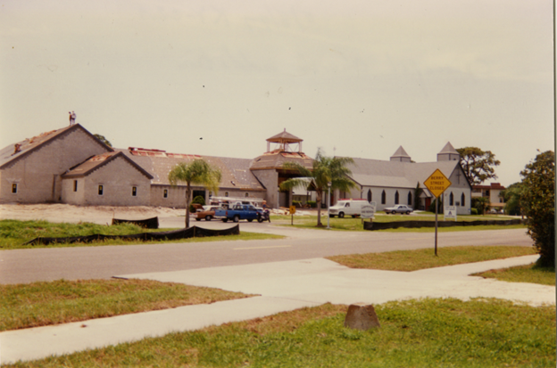 A row of churches are lined up on a residential street