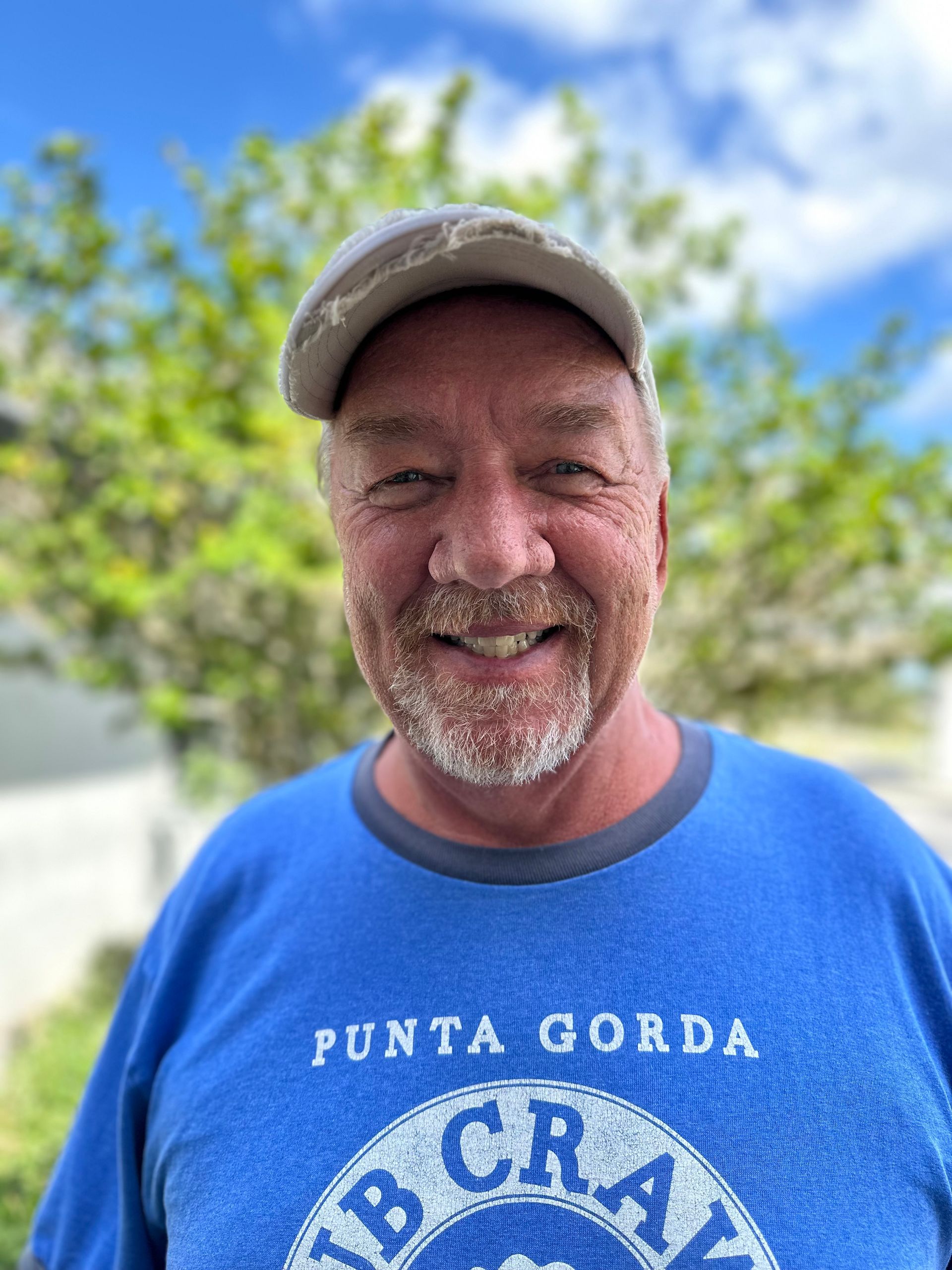 A man wearing a blue shirt that says punta gorda
