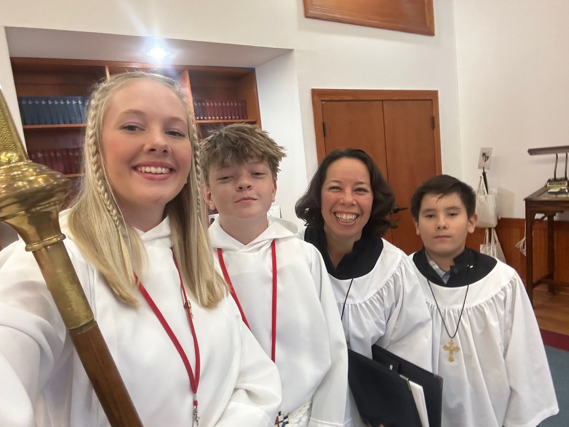 A group of people are posing for a picture in a church.