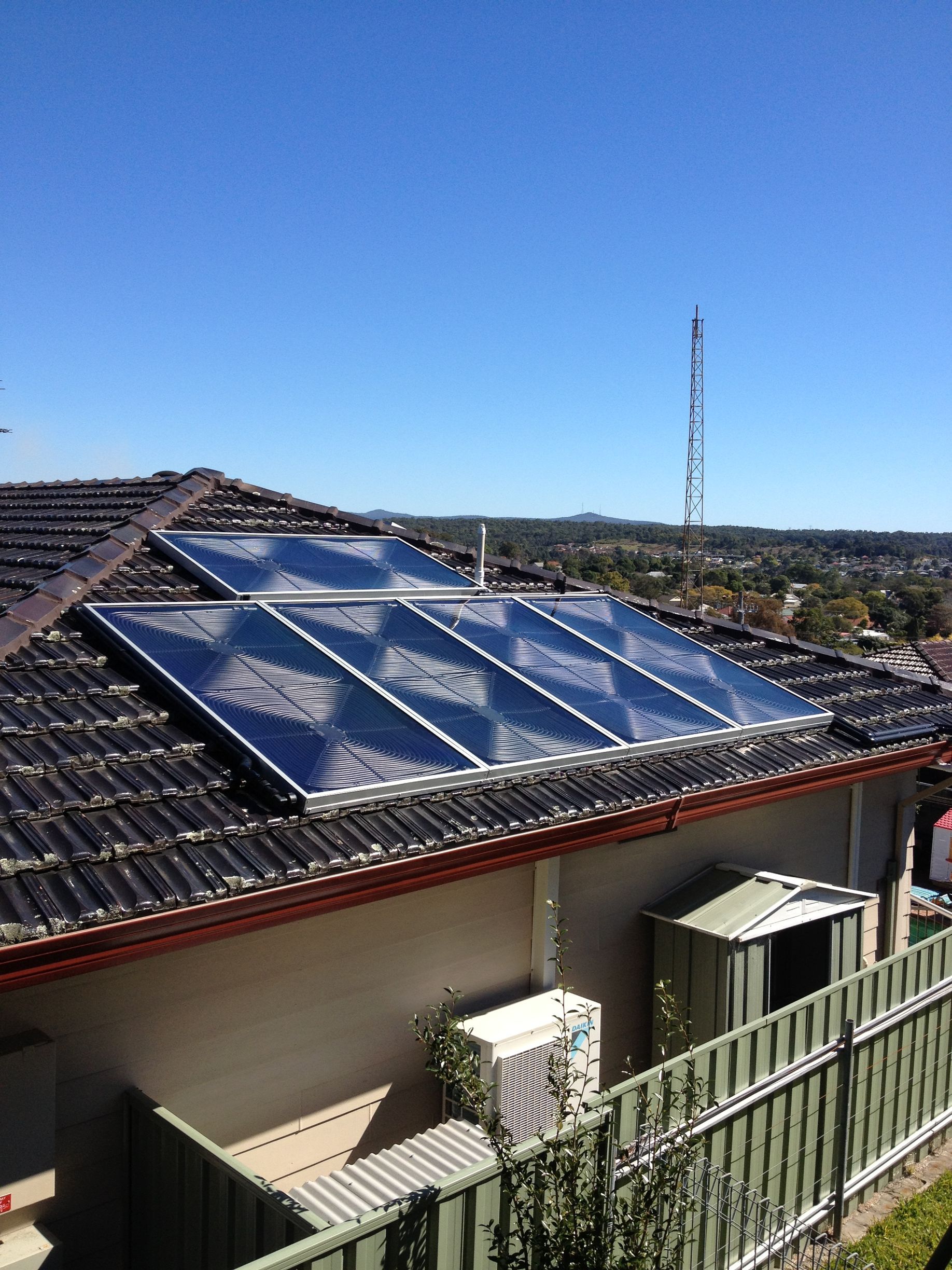 A House with a Lot of Solar Panels on The Roof —  Pool Services in Newcastle
