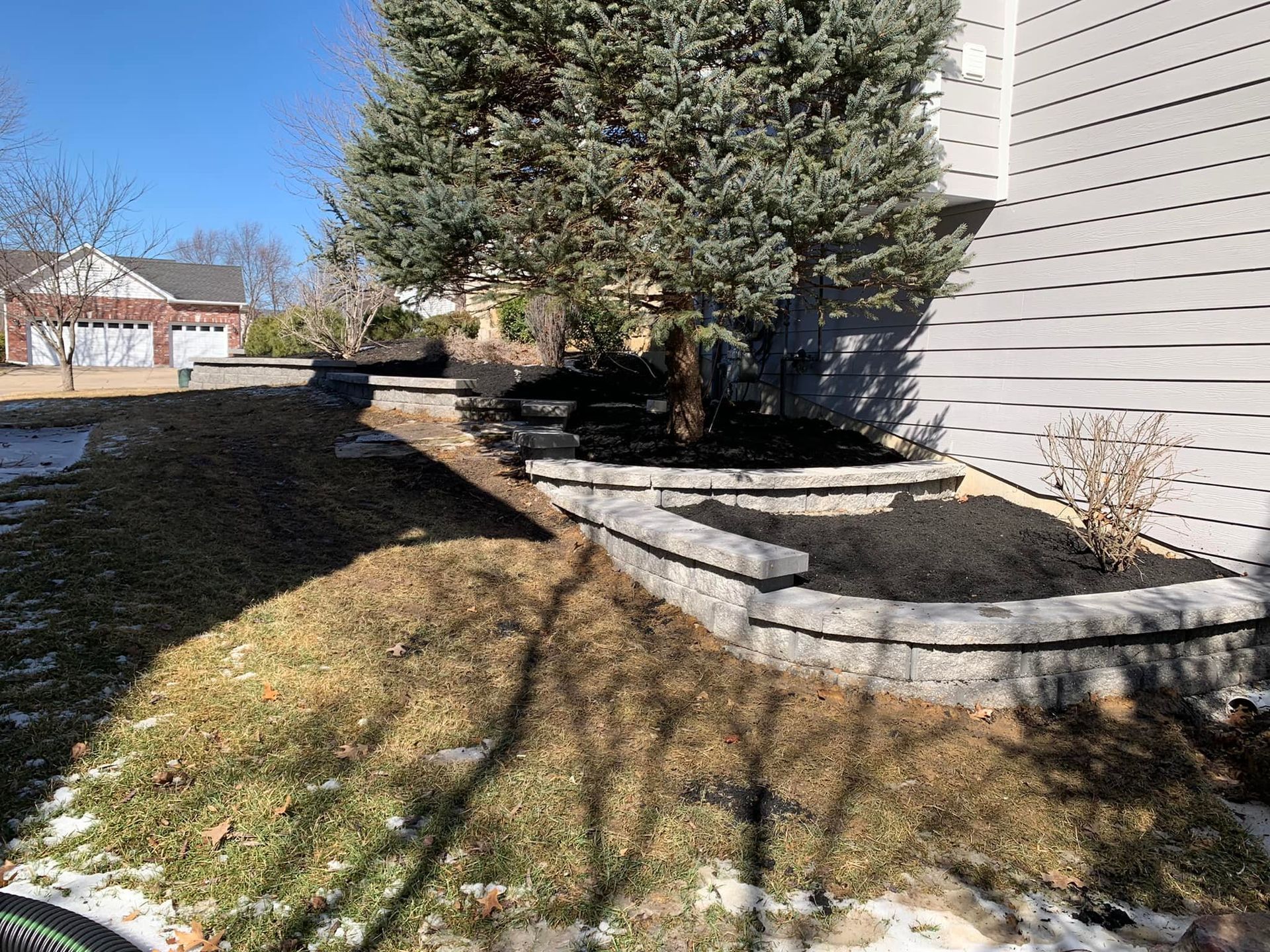 There Is a Tree in The Backyard of A House | O’Fallon, MO | Vickscapes Land Maintenance and Pools