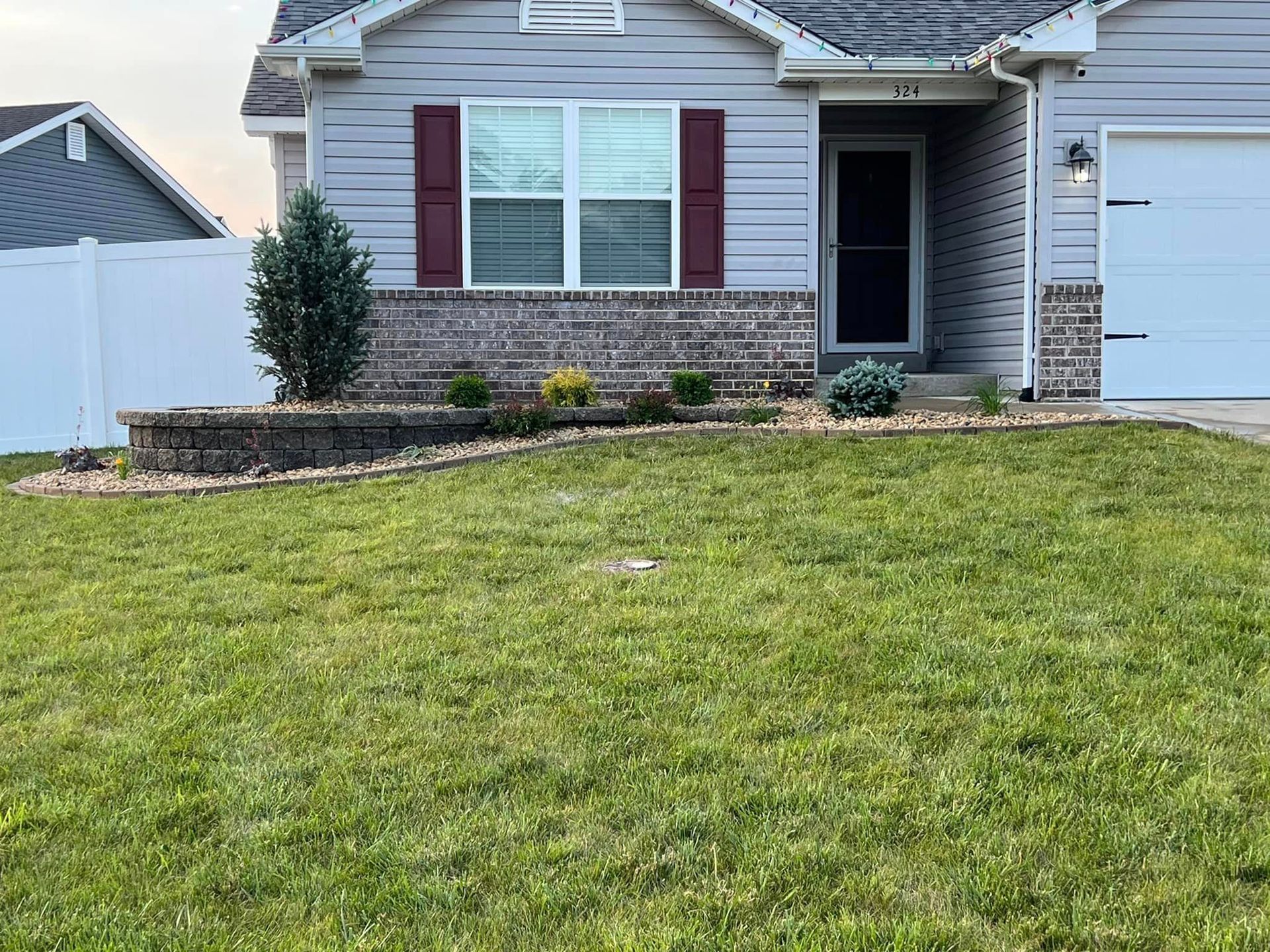 A House with A Large Lawn in Front of It | O’Fallon, MO | Vickscapes Land Maintenance and Pools