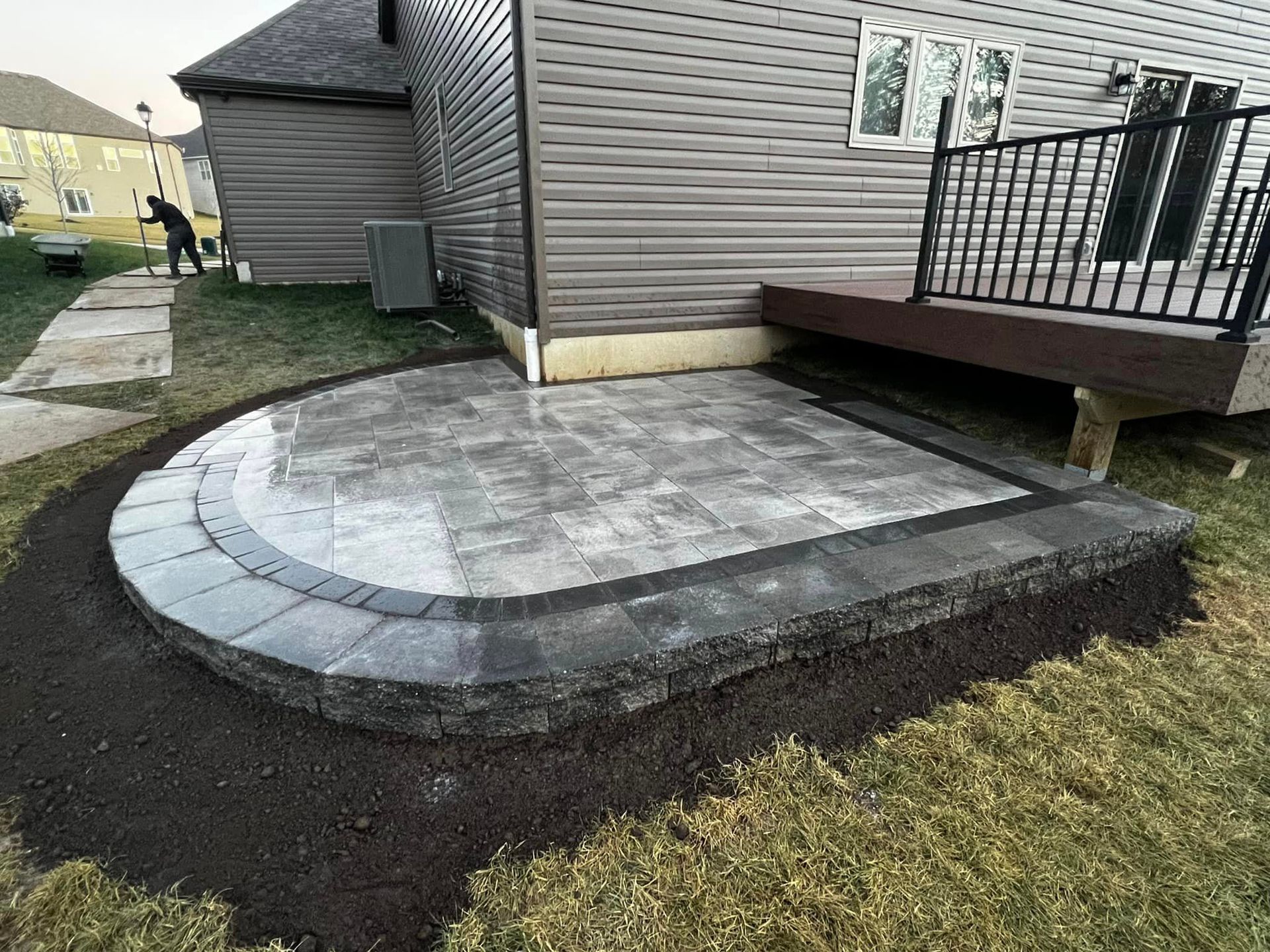 A Patio Is Being Built in The Backyard of A House | O’Fallon, MO | Vickscapes Land Maintenance and Pools