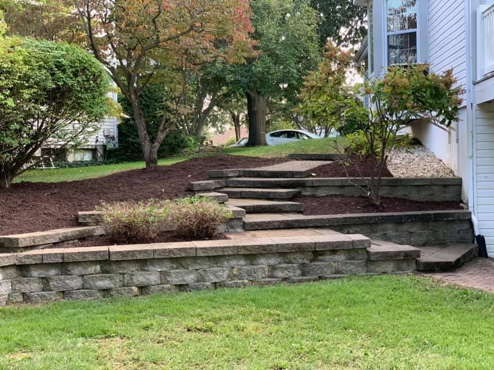 There Are Stairs Leading up To a House in The Backyard | O’Fallon, MO | Vickscapes Land Maintenance and Pools