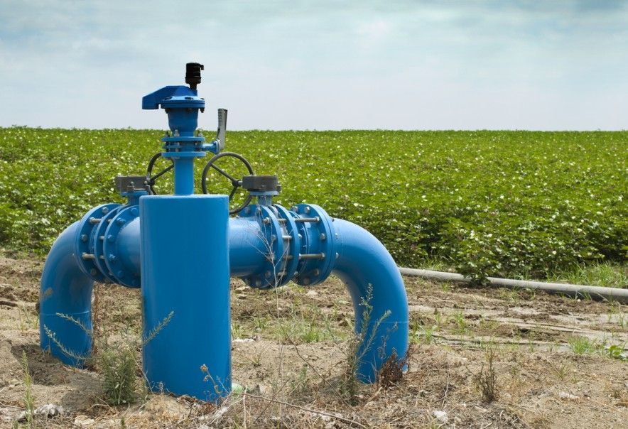 A Blue Pipe is Sitting in the Middle of a Field — Wade N Water In Armidale, NSW