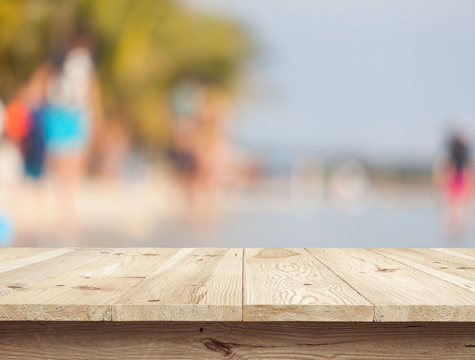 Fresh wooden planks lie on a bright surface.