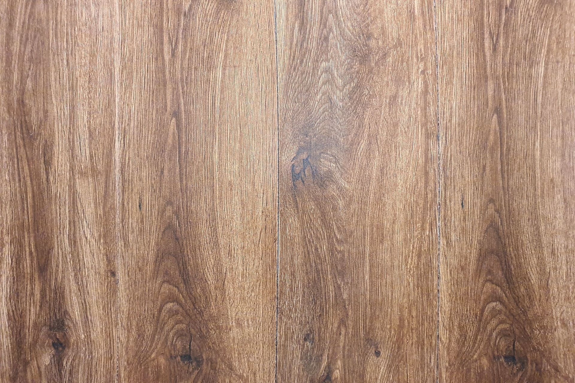 Natural wood surface with warm brown tones and clear grain. Natural wood surface with warm brown tones and clear grain.
