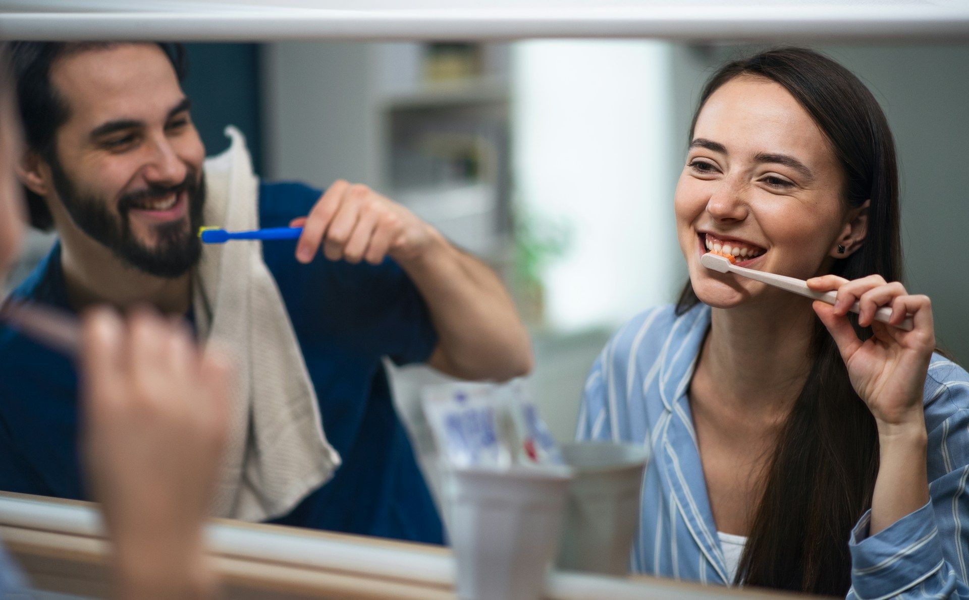 couple brushing teeth