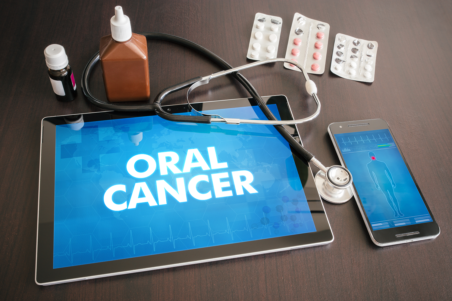 a tablet with the word oral cancer on it