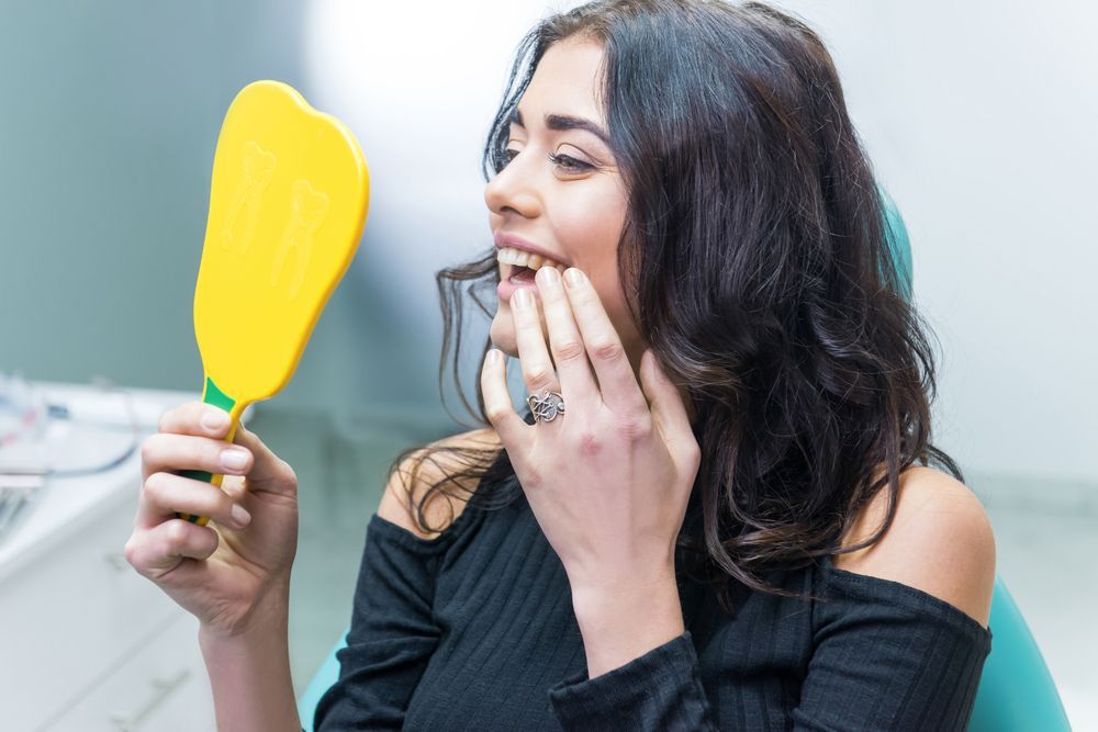 women smiling in the dental treatment room 