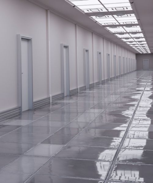 A long hallway with a lot of windows and doors